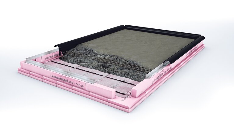 Querschnitt einer rosa Wärmedämmplatte aus Extruderschaum mit Stufenfalz, mehrschichtiger Aufbau.